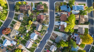 aerial view of residential neighborhood in the autumn | self management