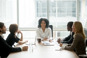female leading corporate diverse team meeting | hoa board training