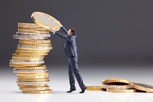 man in suit stacking giant coins | hoa treasurer responsibilities