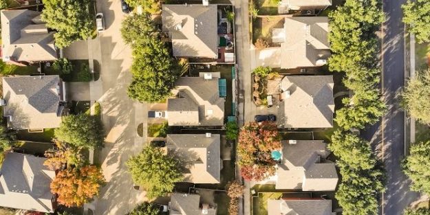Panorama aerial drone view row of single-family detached house in residential area with colorful autumn leaves. Straight down view of suburban subdivision near Dallas, Texas, USA Operating Funds vs Reserve Funds: What’s The Difference