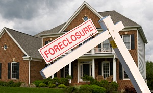 leaning foreclosure sign in front of a modern single family home | hoa dues