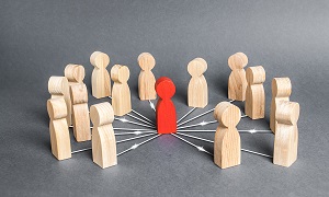 red model person is connected with wooden model person by wide network of lines | HOA management options