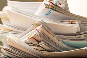 stack of document paper with colorful paperclip | hoa governing documents