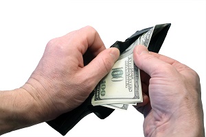 isolated male hand and opened purse with money | hoa accounting