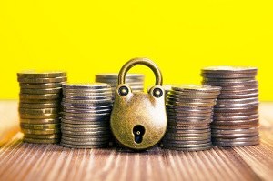 stack of coins and padlock | hoa assessment