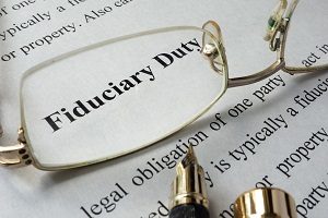 view of fiduciary duty word through eyeglasses | how to present a budget