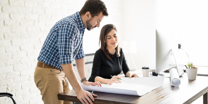 Architects reviewing some plans The Ultimate HOA Architectural Review Guide